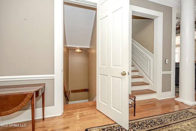 1401 Ladnier Rd, Gautier, MS 39553 - staircase featuring baseboards, wood finished floors, and ornamental molding