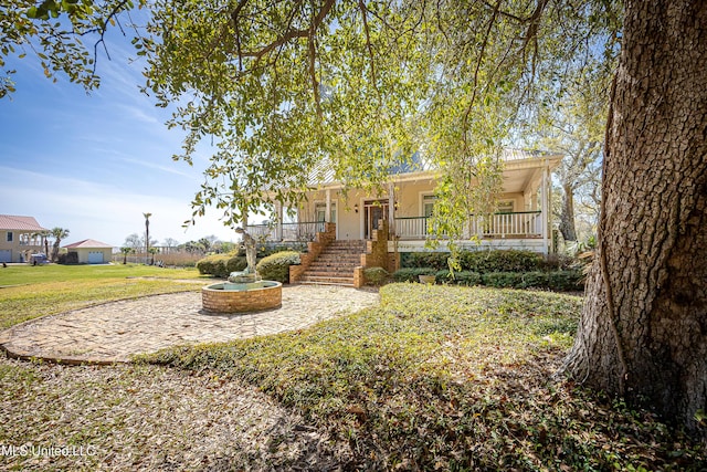 1401 Ladnier Rd, Gautier, MS 39553 - view of front of home featuring a front yard and a porch