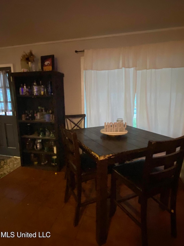 dining space featuring tile patterned flooring