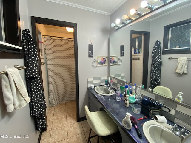 bathroom featuring ornamental molding, tile patterned flooring, curtained shower, and vanity