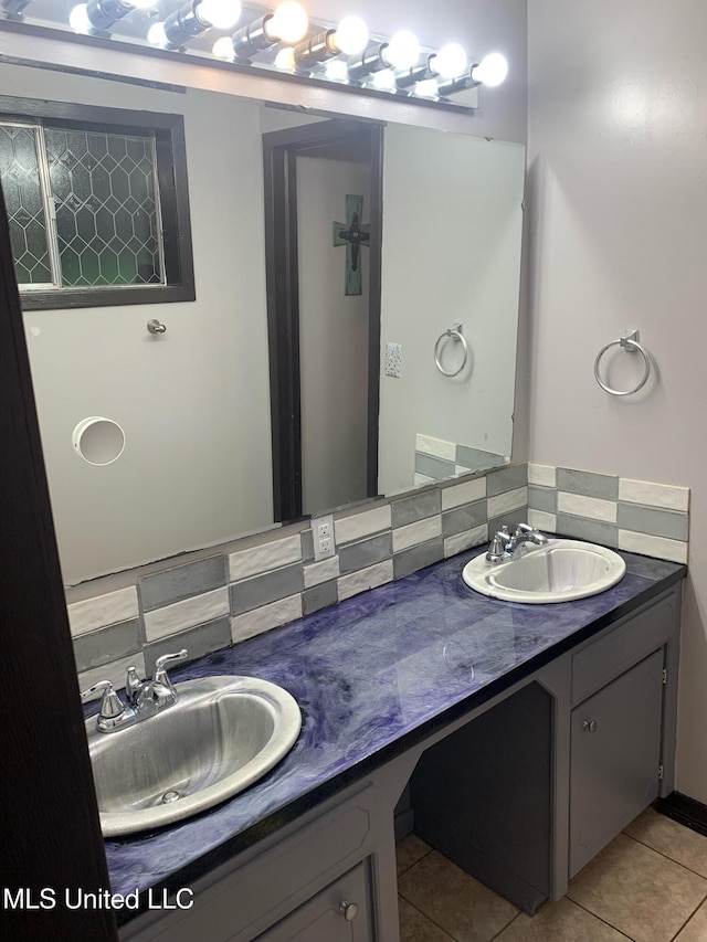 bathroom featuring tile patterned flooring and vanity