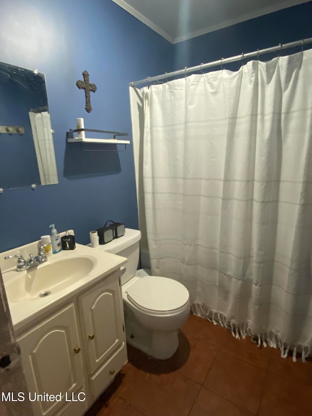 bathroom featuring vanity, tile patterned flooring, toilet, and crown molding