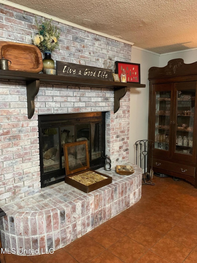 interior details with a fireplace, tile patterned flooring, and a textured ceiling