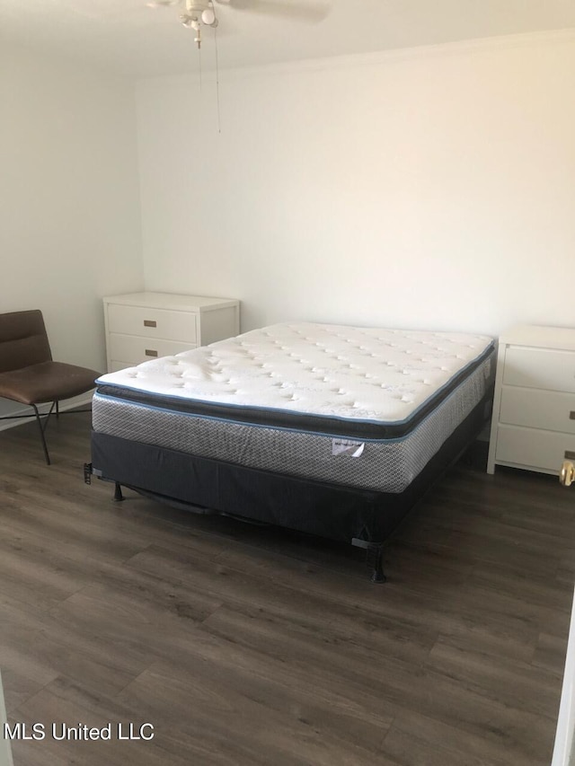 bedroom featuring dark hardwood / wood-style floors and ceiling fan