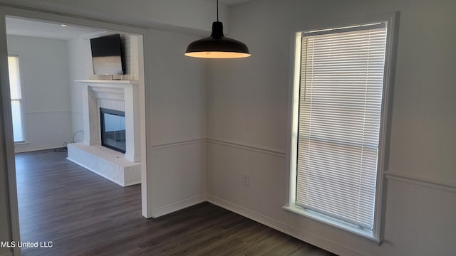 unfurnished dining area with dark hardwood / wood-style flooring