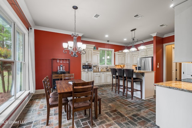 10 Magnolia Crossing Rd, Sumrall, MS 39482 - dining area featuring brick flooring, a chandelier, crown molding, recessed lighting, and baseboards