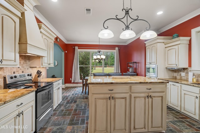 10 Magnolia Crossing Rd, Sumrall, MS 39482 - kitchen featuring appliances with stainless steel finishes, cream cabinets, custom exhaust hood, a chandelier, and baseboards