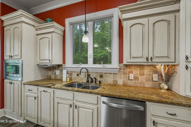 10 Magnolia Crossing Rd, Sumrall, MS 39482 - kitchen with stainless steel dishwasher, a sink, decorative backsplash, decorative light fixtures, and dark stone counters