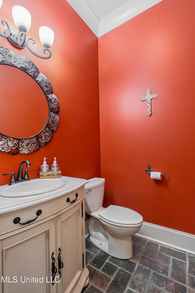 10 Magnolia Crossing Rd, Sumrall, MS 39482 - half bathroom with stone finish flooring, toilet, baseboards, and vanity