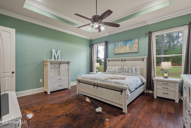 10 Magnolia Crossing Rd, Sumrall, MS 39482 - bedroom with crown molding, dark wood-style floors, a raised ceiling, baseboards, and ceiling fan