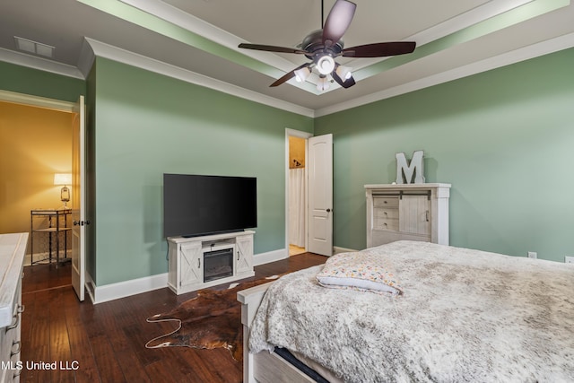 10 Magnolia Crossing Rd, Sumrall, MS 39482 - bedroom featuring crown molding, wood-type flooring, baseboards, a fireplace, and ceiling fan