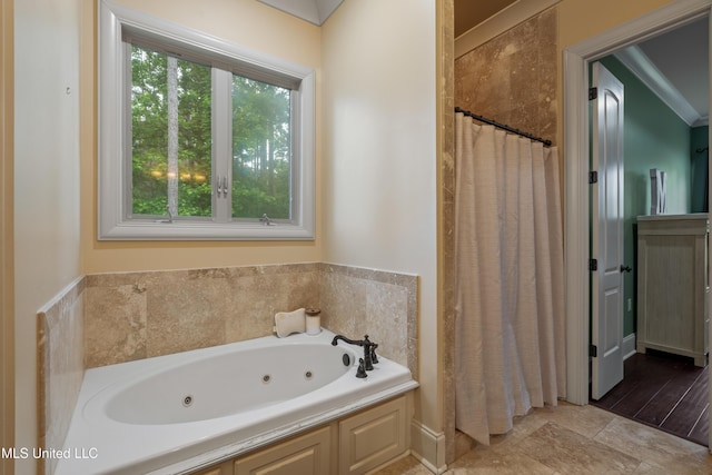10 Magnolia Crossing Rd, Sumrall, MS 39482 - full bath with a jetted tub, a shower with shower curtain, and baseboards