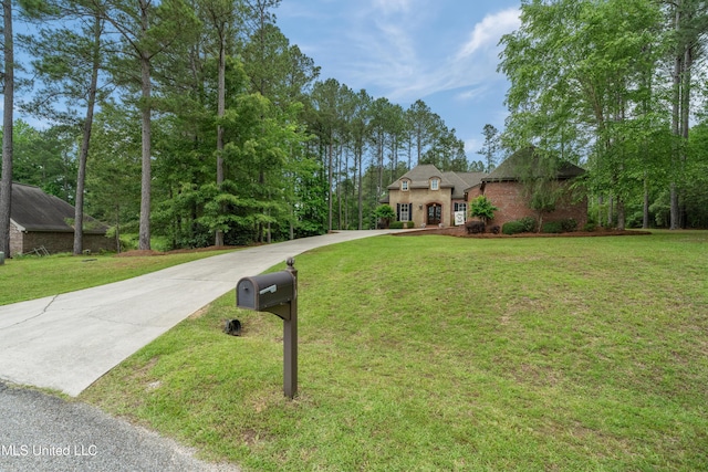 10 Magnolia Crossing Rd, Sumrall, MS 39482 - french country inspired facade featuring driveway and a front yard