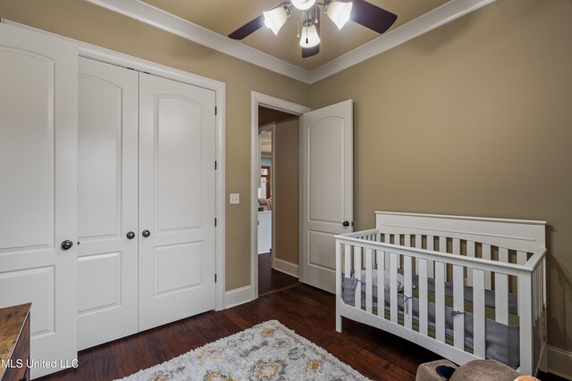 10 Magnolia Crossing Rd, Sumrall, MS 39482 - bedroom featuring a closet, wood finished floors, a nursery area, a ceiling fan, and crown molding
