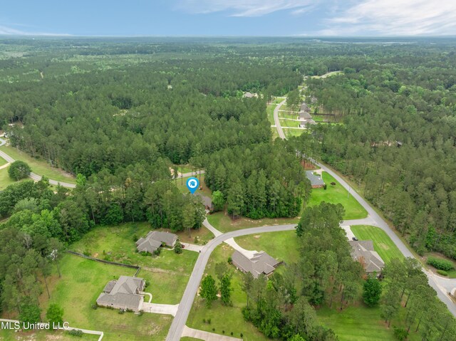 10 Magnolia Crossing Rd, Sumrall, MS 39482 - aerial view of property and surrounding area featuring a forest