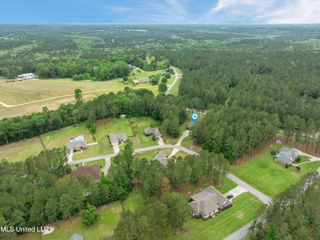 10 Magnolia Crossing Rd, Sumrall, MS 39482 - aerial overview of property's location with a heavily wooded area