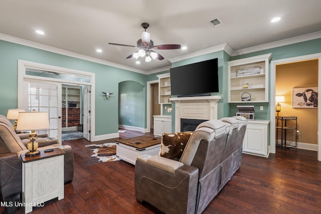 10 Magnolia Crossing Rd, Sumrall, MS 39482 - living area featuring baseboards, dark wood-style flooring, crown molding, a fireplace, and a ceiling fan