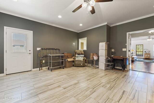 miscellaneous room featuring ceiling fan, crown molding, and light hardwood / wood-style floors