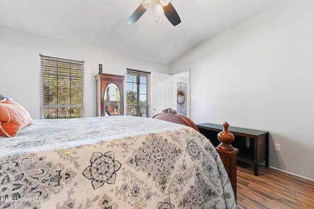 bedroom featuring lofted ceiling, hardwood / wood-style flooring, and ceiling fan