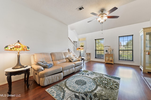 living room featuring ceiling fan, a textured ceiling, lofted ceiling, and dark hardwood / wood-style floors