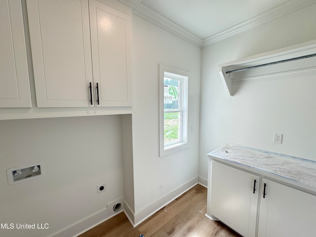 laundry room with cabinets, washer hookup, light wood-type flooring, ornamental molding, and hookup for an electric dryer