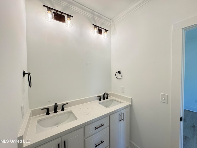 bathroom featuring crown molding and vanity