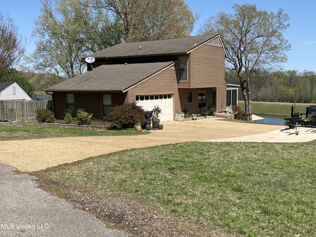 4858 Victoria Dr, Nesbit, MS 38651 - view of home's exterior with concrete driveway, a shingled roof, and a garage