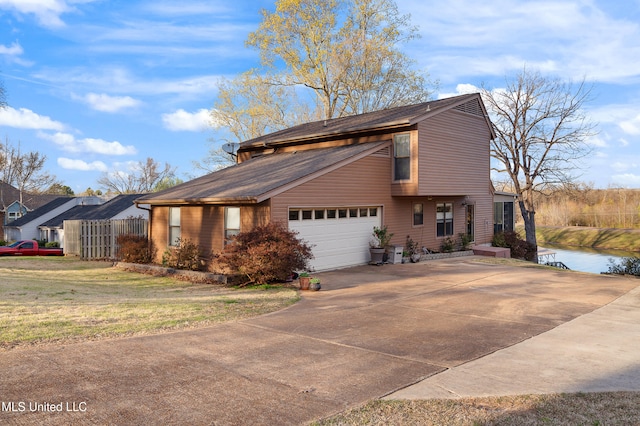 4858 Victoria Dr, Nesbit, MS 38651 - view of side of property featuring driveway, a garage, and roof with shingles