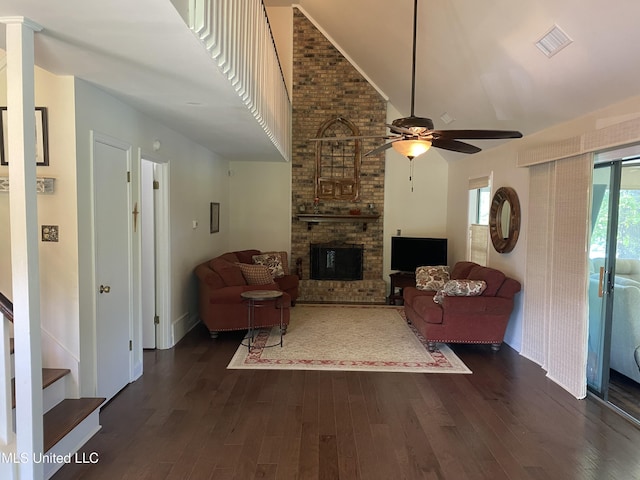 4858 Victoria Dr, Nesbit, MS 38651 - living room with a ceiling fan, dark wood-style floors, high vaulted ceiling, a fireplace, and baseboards