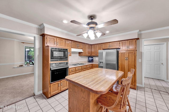 8140 Hunters Hill Cv, Olive Branch, MS 38654 - kitchen with black appliances, light tile patterned flooring, ceiling fan, baseboards, and recessed lighting
