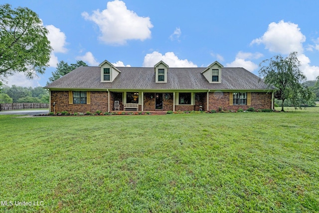 8140 Hunters Hill Cv, Olive Branch, MS 38654 - cape cod-style house with brick siding, covered porch, and a shingled roof