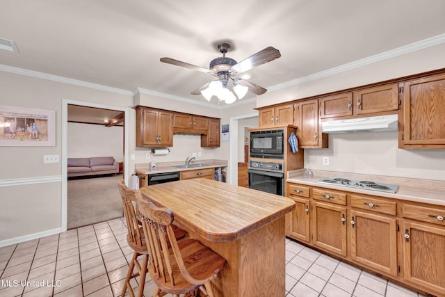 8140 Hunters Hill Cv, Olive Branch, MS 38654 - kitchen featuring black appliances, under cabinet range hood, a sink, light tile patterned flooring, and crown molding