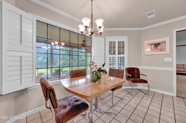 8140 Hunters Hill Cv, Olive Branch, MS 38654 - tiled dining area with crown molding, a chandelier, and baseboards