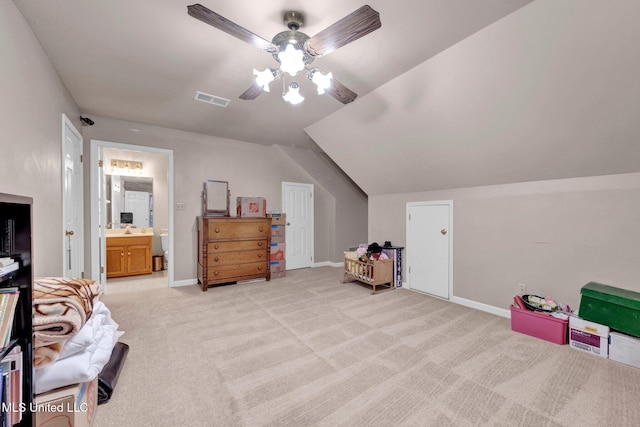 8140 Hunters Hill Cv, Olive Branch, MS 38654 - bedroom with lofted ceiling, light carpet, baseboards, ceiling fan, and ensuite bath