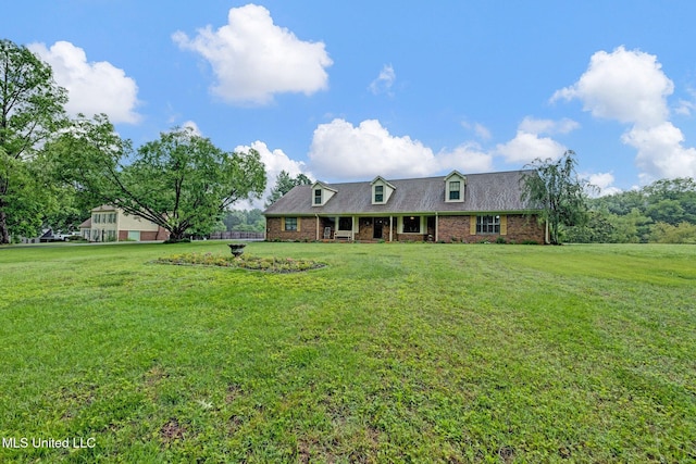 8140 Hunters Hill Cv, Olive Branch, MS 38654 - cape cod-style house with a front yard and brick siding