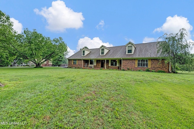 8140 Hunters Hill Cv, Olive Branch, MS 38654 - cape cod house with a front yard, brick siding, and covered porch