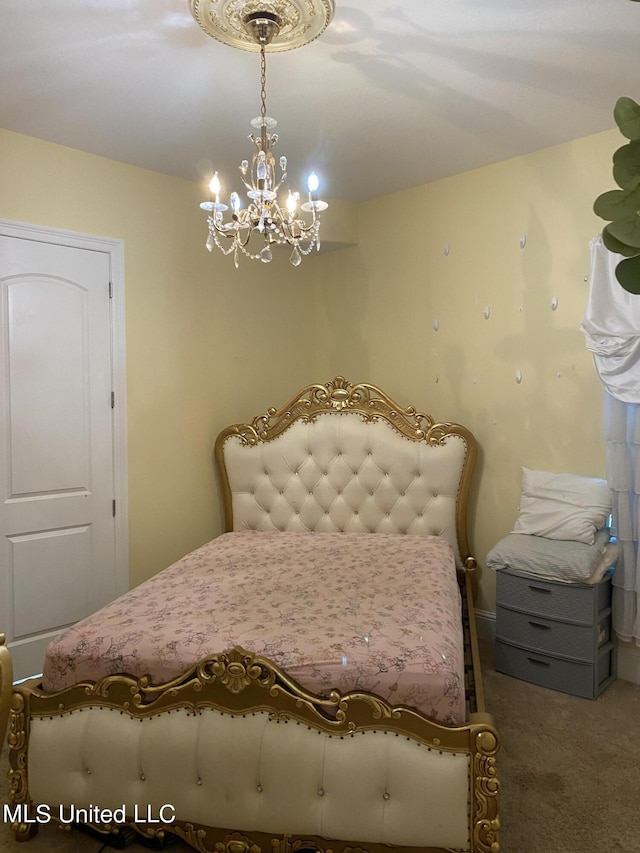 bedroom with carpet floors and a notable chandelier