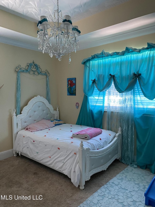 carpeted bedroom with a chandelier and ornamental molding