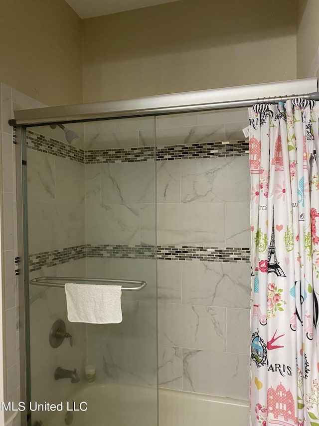 full bathroom featuring bath / shower combo with glass door