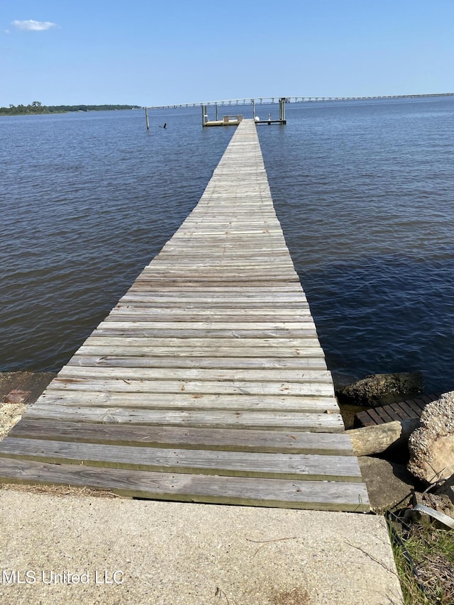 dock area featuring a water view