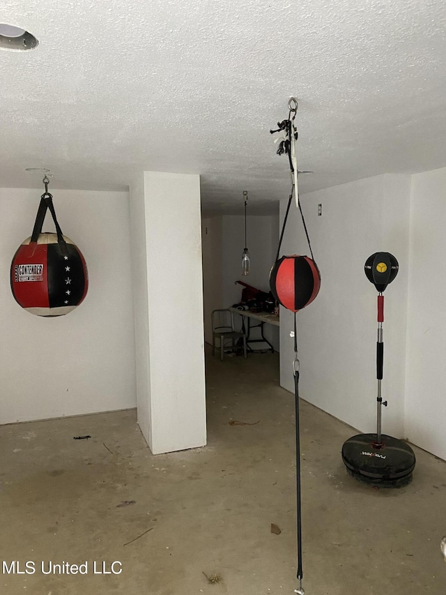 below grade area featuring a textured ceiling