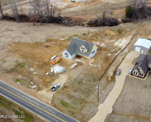 birds eye view of property featuring a rural view