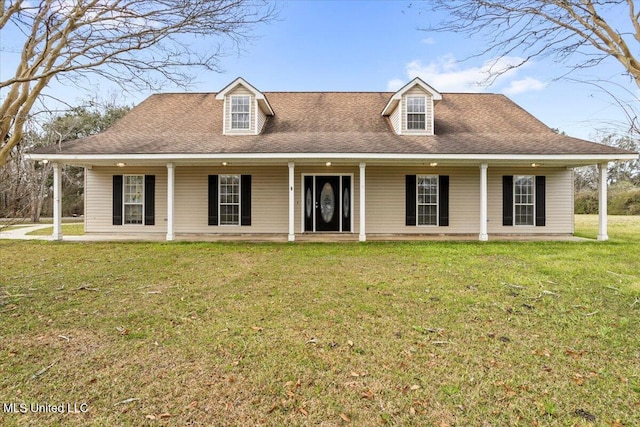 view of front of house featuring a shingled roof, a front yard, and covered porch