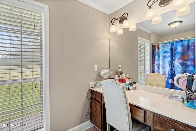 full bath featuring a wealth of natural light, crown molding, and vanity