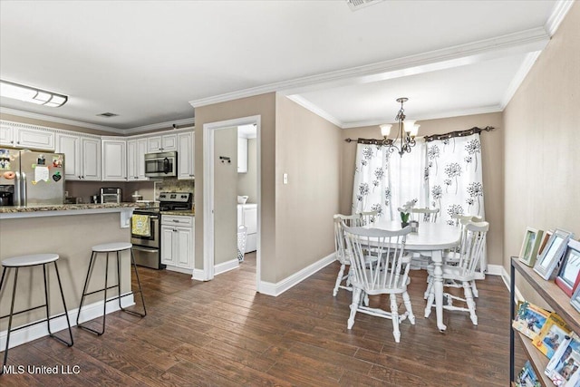 dining space featuring crown molding, dark wood finished floors, baseboards, and an inviting chandelier