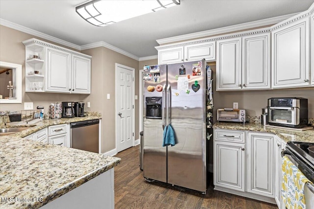 kitchen with dark wood finished floors, ornamental molding, light stone countertops, stainless steel appliances, and a sink