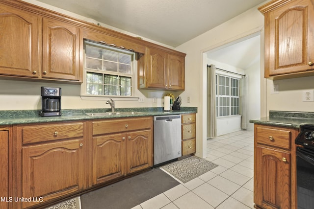 1317 Rosemont Dr, Gautier, MS 39553 - kitchen featuring stainless steel dishwasher, stove, dark countertops, a sink, and light tile patterned flooring