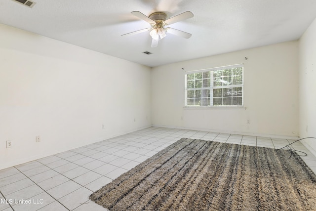 1317 Rosemont Dr, Gautier, MS 39553 - spare room with light tile patterned flooring, a ceiling fan, and baseboards