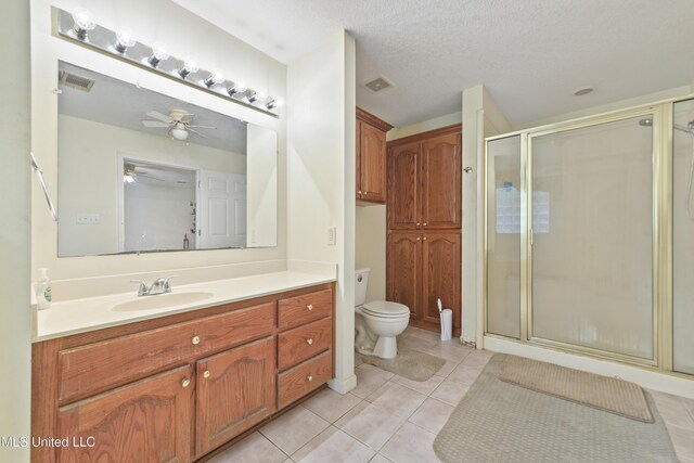 1317 Rosemont Dr, Gautier, MS 39553 - full bathroom featuring a stall shower, tile patterned floors, toilet, and ceiling fan