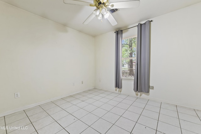 1317 Rosemont Dr, Gautier, MS 39553 - empty room with a ceiling fan, light tile patterned flooring, and baseboards